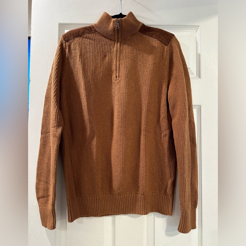 Brown sweater with suede shoulders in good condition.